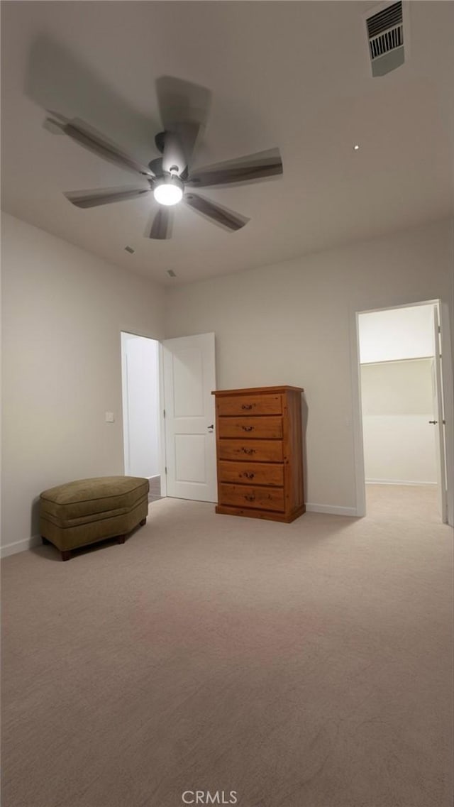 unfurnished bedroom with ceiling fan and light colored carpet