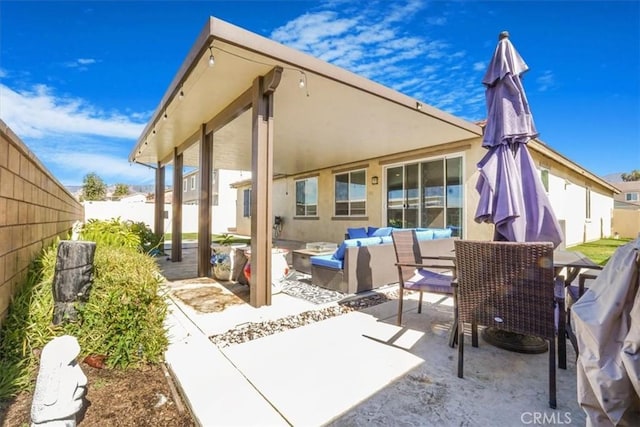 view of patio with a fenced backyard and an outdoor living space