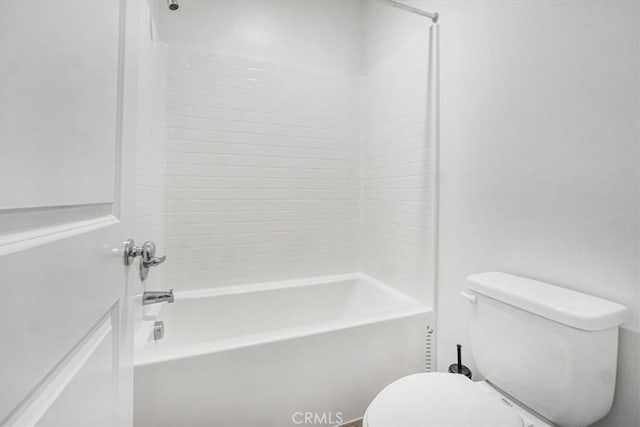 bathroom featuring  shower combination and toilet