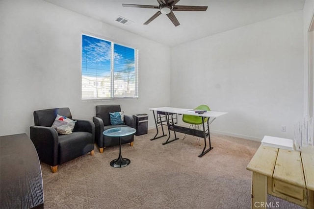 home office with ceiling fan, visible vents, baseboards, and light colored carpet