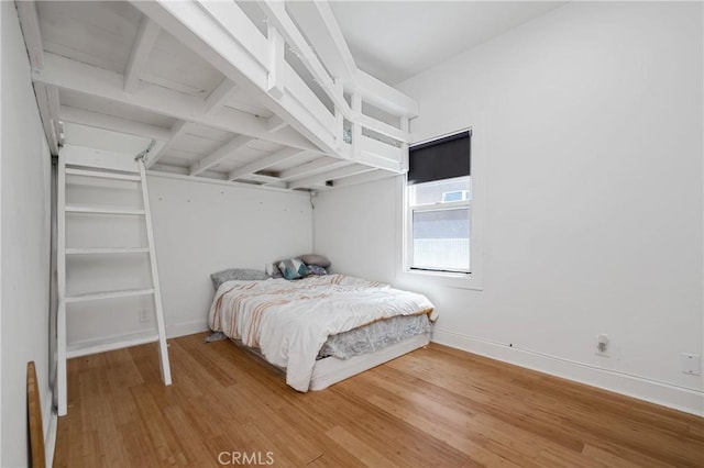 bedroom featuring hardwood / wood-style flooring