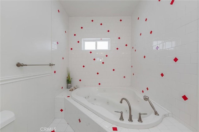 bathroom with tiled bath