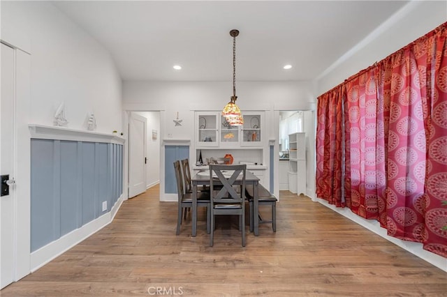 dining room with wood-type flooring