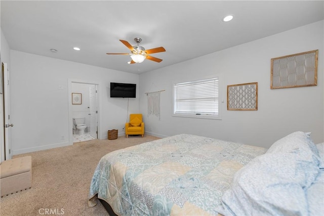 bedroom featuring ensuite bathroom, ceiling fan, and carpet flooring