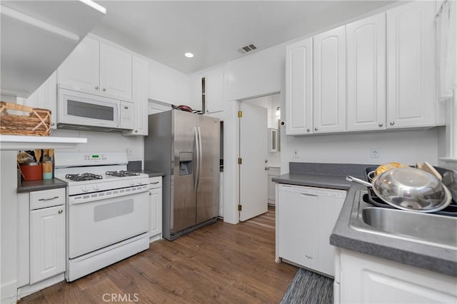 kitchen with white cabinetry, white appliances, sink, and dark wood-type flooring