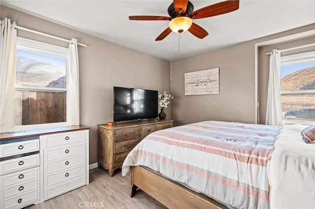 bedroom featuring ceiling fan and light wood-type flooring