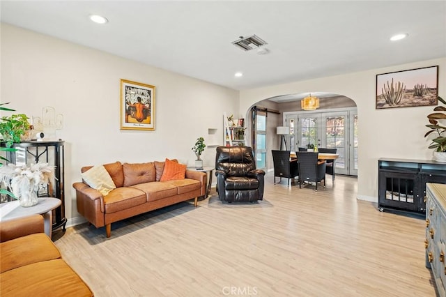 living room with light hardwood / wood-style flooring