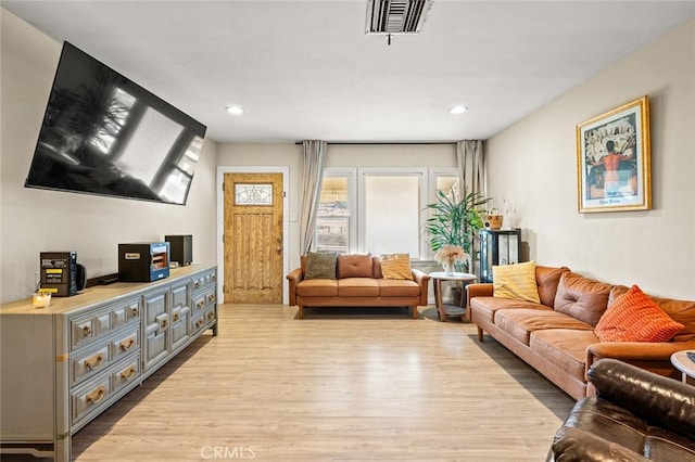 living room with light hardwood / wood-style floors