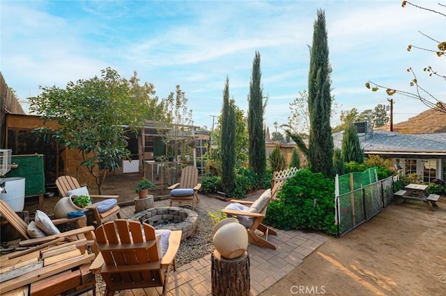 view of patio / terrace featuring an outdoor fire pit