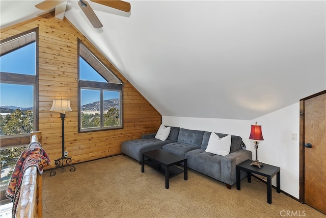 46727 Minnow, Big Bear City, CA 92314 - carpeted living room featuring wood walls, lofted ceiling, and a ceiling fan