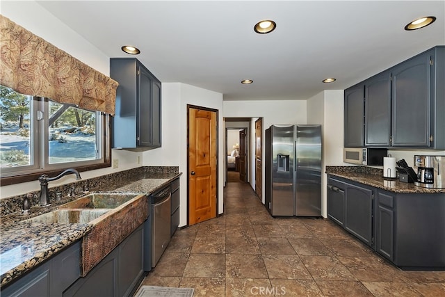 46727 Minnow, Big Bear City, CA 92314 - kitchen featuring appliances with stainless steel finishes, dark stone counters, recessed lighting, a sink, and dark stone finish floors