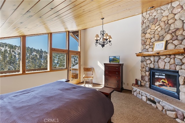 46727 Minnow, Big Bear City, CA 92314 - carpeted bedroom with a fireplace, a chandelier, wooden ceiling, and baseboards