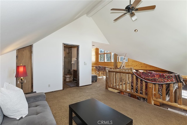 carpeted living room featuring lofted ceiling with beams and ceiling fan