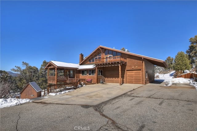 log-style house with a deck