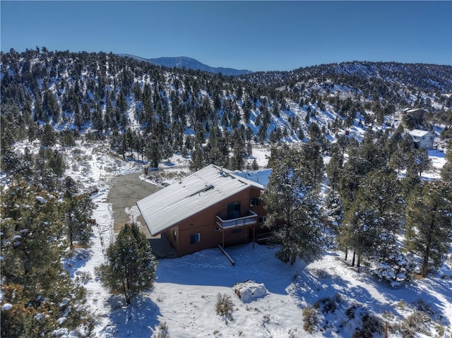 snowy aerial view featuring a mountain view