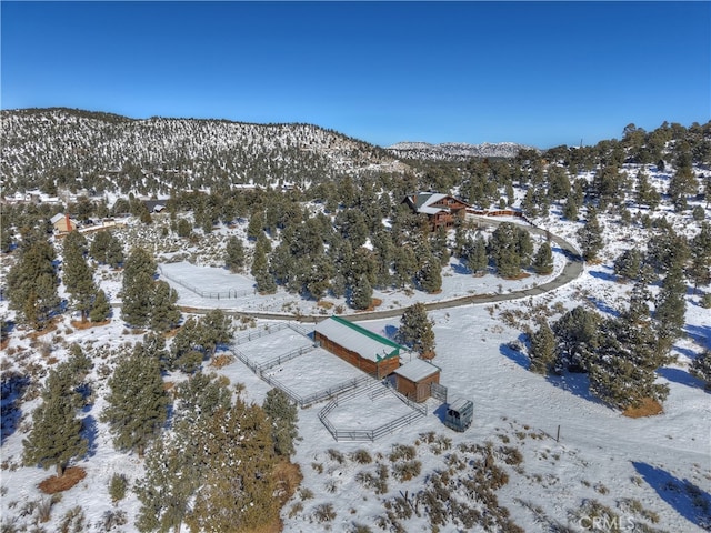 snowy aerial view with a mountain view