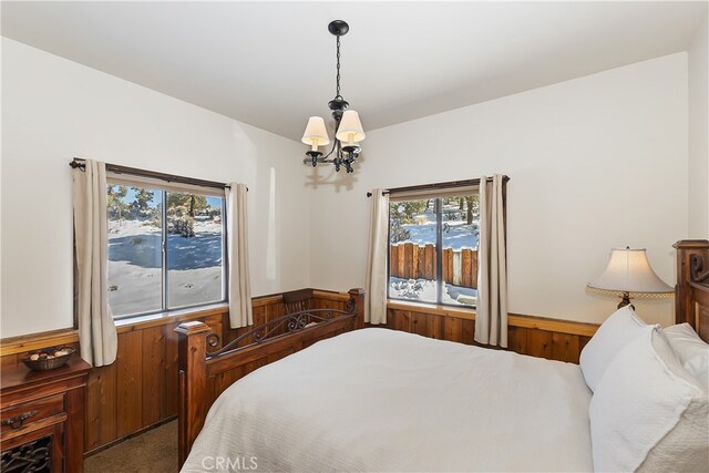 bedroom featuring a notable chandelier