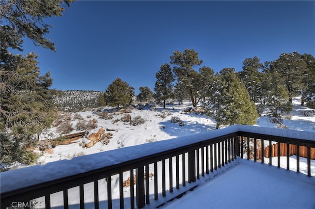 view of snow covered deck