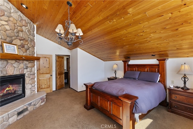 bedroom featuring a stone fireplace, lofted ceiling, a chandelier, light colored carpet, and wood ceiling