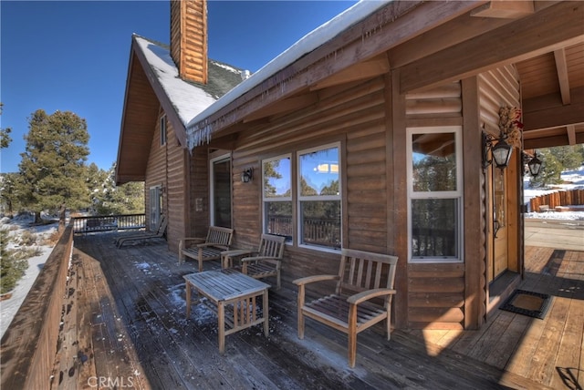 view of snow covered deck