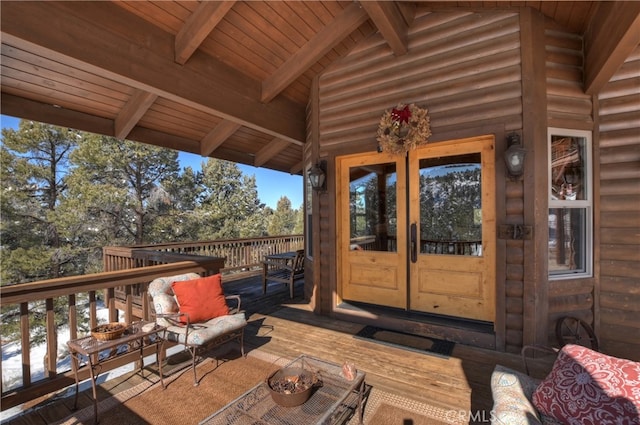 wooden terrace with outdoor lounge area