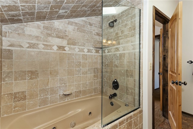 bathroom featuring lofted ceiling and tiled shower / bath combo