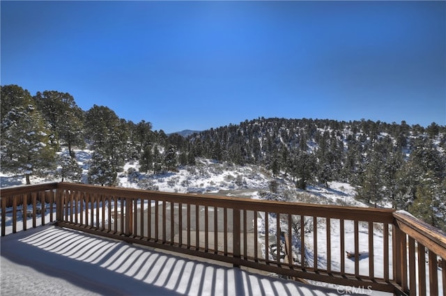 view of snow covered deck