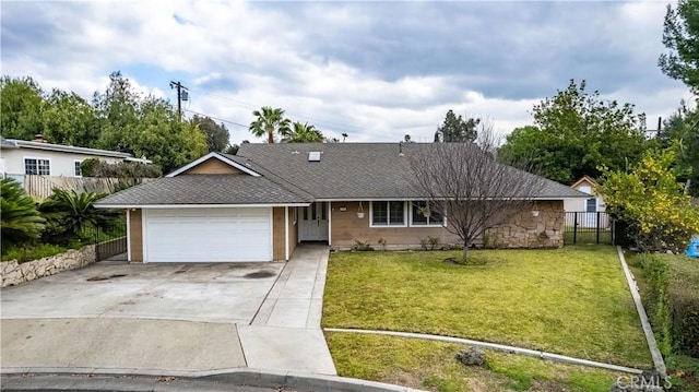 ranch-style home with a garage and a front yard