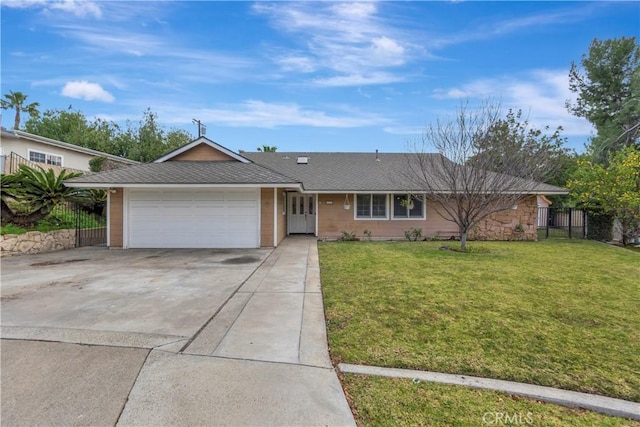 single story home featuring a garage and a front lawn