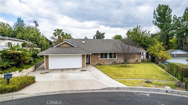 ranch-style house with a garage and a front lawn