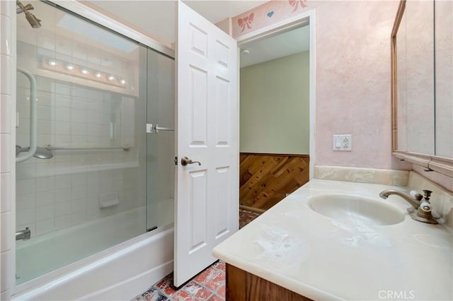 bathroom with enclosed tub / shower combo and vanity