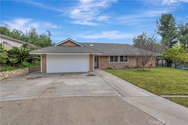 single story home featuring a garage and a front lawn