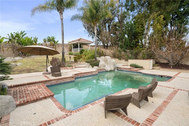 view of swimming pool with a gazebo and a patio area