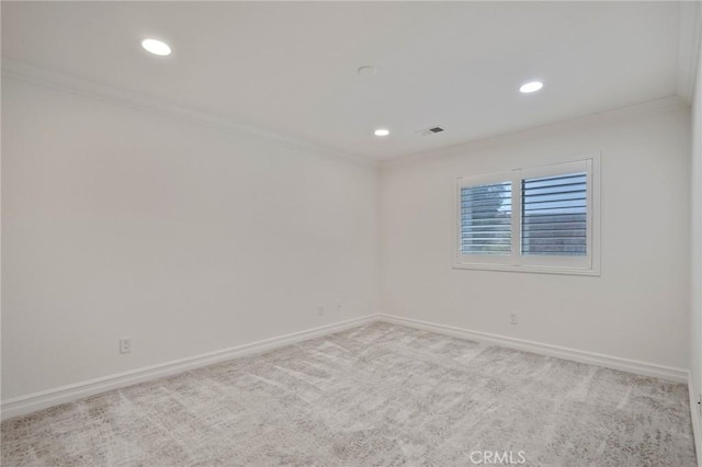 carpeted spare room with ornamental molding