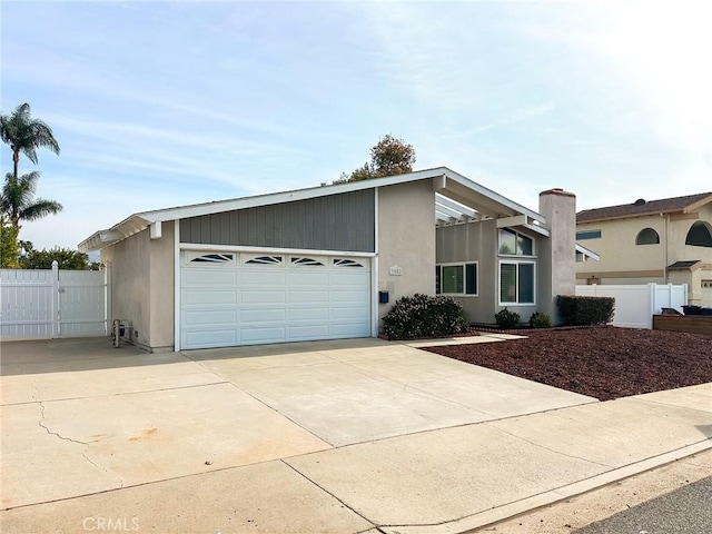 ranch-style house featuring a garage