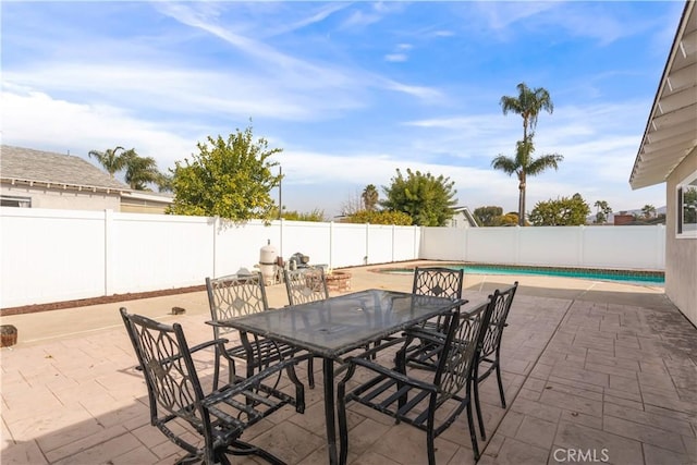 view of patio / terrace featuring a fenced in pool