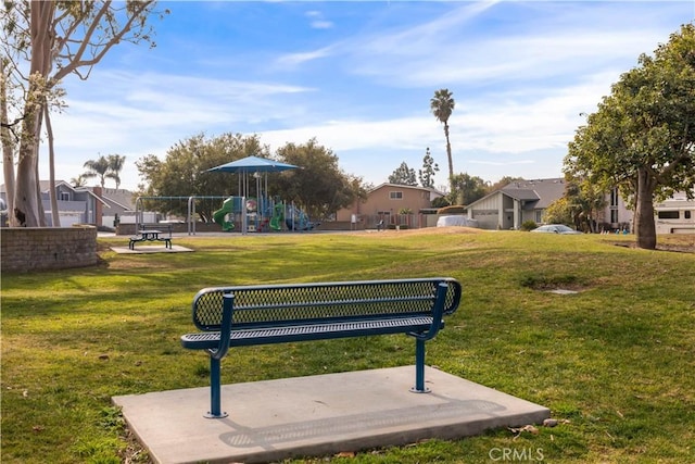 surrounding community featuring a yard and a playground