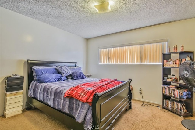 carpeted bedroom with a textured ceiling