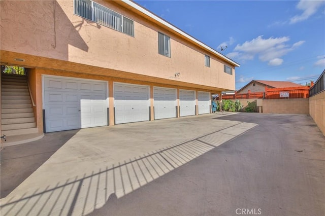 view of side of home with a garage