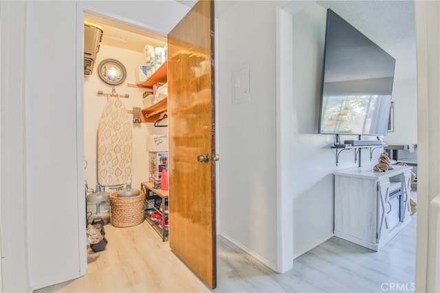 bathroom with hardwood / wood-style floors