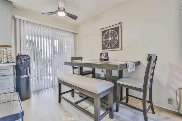 dining area with ceiling fan