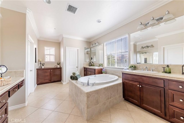 bathroom featuring vanity, tile patterned floors, and a healthy amount of sunlight