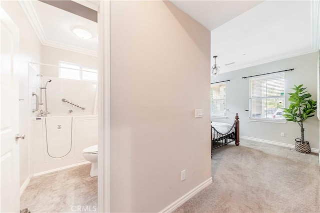 bathroom with ornamental molding, toilet, and a shower