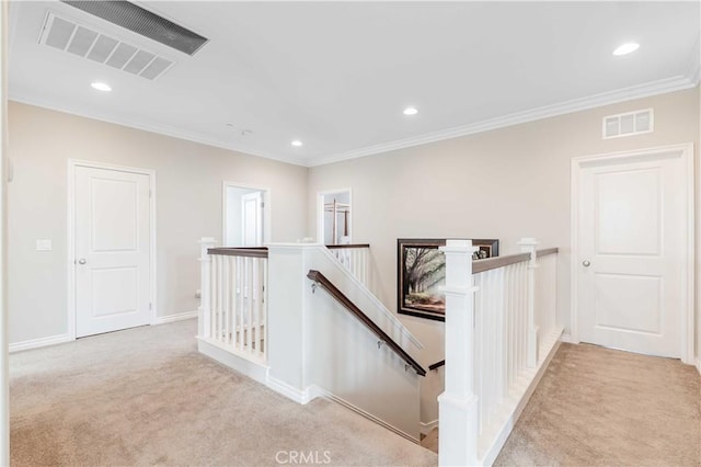 corridor with light carpet and crown molding