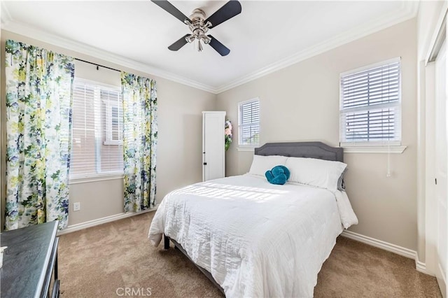 bedroom with crown molding, light colored carpet, and ceiling fan