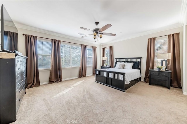 bedroom featuring crown molding, light colored carpet, and ceiling fan