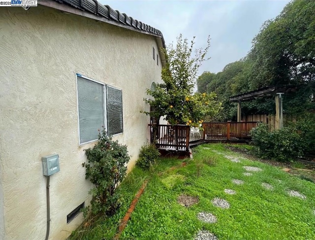 view of yard with a wooden deck