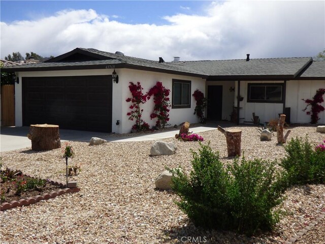 ranch-style house featuring a garage