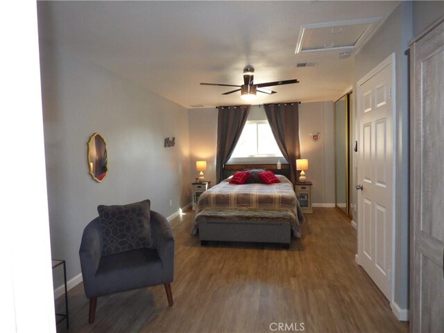 bedroom featuring hardwood / wood-style flooring and ceiling fan