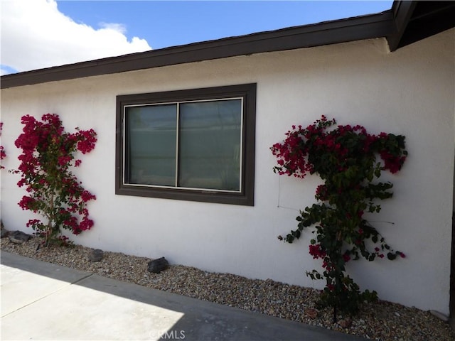 view of side of home with a patio area